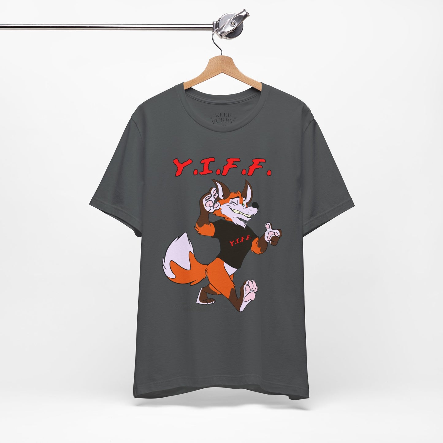 Gray t-shirt with cartoon fox and 'Y.I.F.F.' text on a hanger against a white background