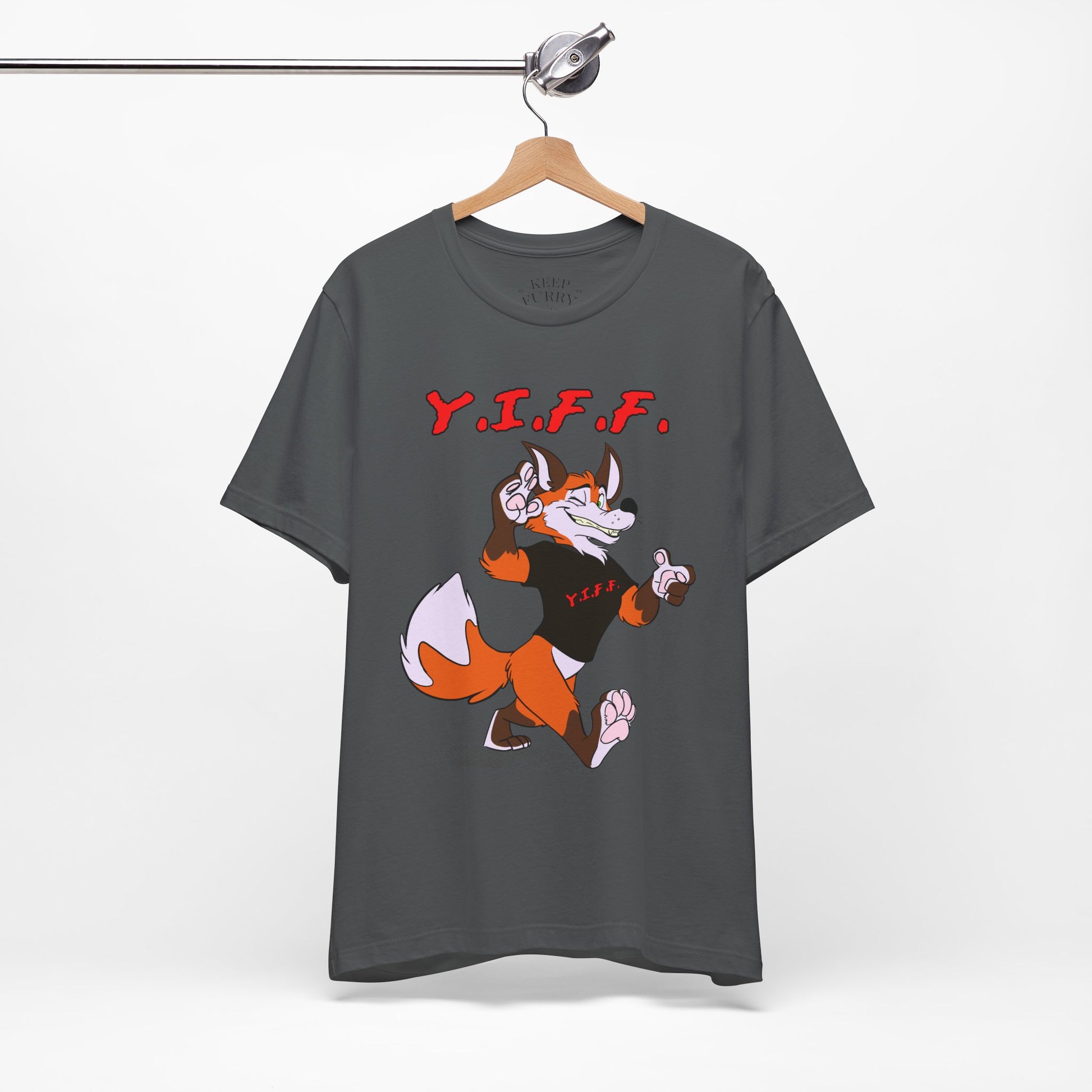 Gray t-shirt with cartoon fox and 'Y.I.F.F.' text on a hanger against a white background