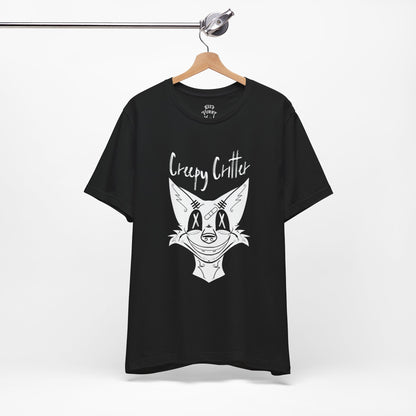 Black t-shirt with creep furry graphic design and text on a hanger against a white background