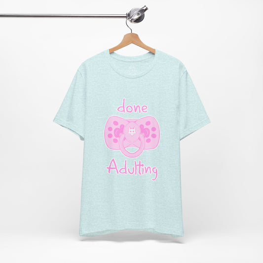 Light blue t-shirt with pink pacifier graphic and text on a white background